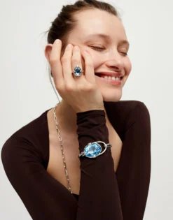 Bangle bracelet with faceted blue crystal