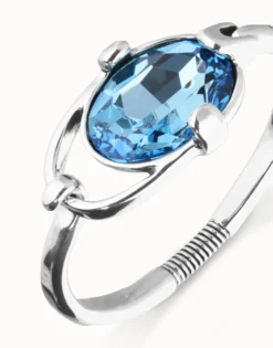 Bangle bracelet with faceted blue crystal