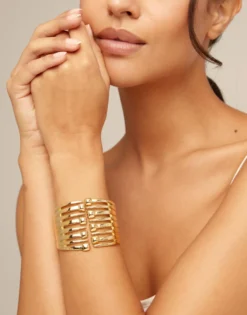 Bangle bracelet with multiple nail heads