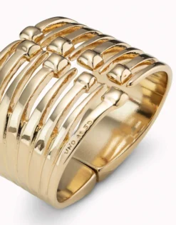 Bangle bracelet with multiple nail heads