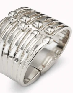 Bangle bracelet with multiple nail heads