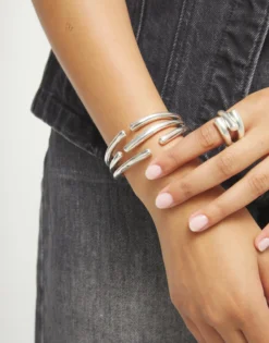Bangle bracelet with multiple intertwined organic shapes