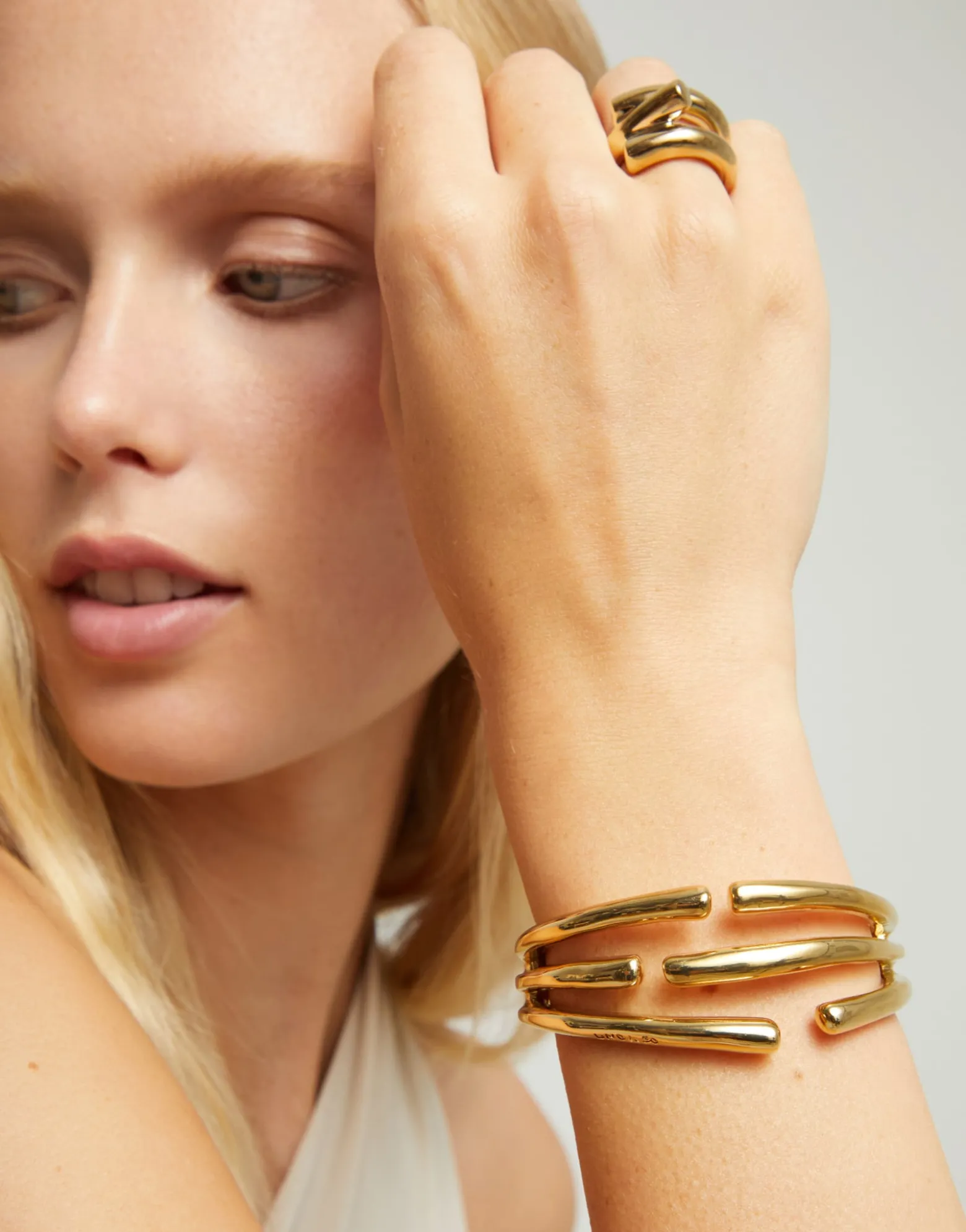 Bangle bracelet with multiple intertwined organic shapes