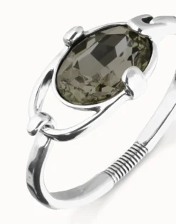 Bangle bracelet with oval faceted gray crystal