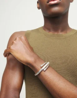 Bangle bracelet with three intertwined organic shapes
