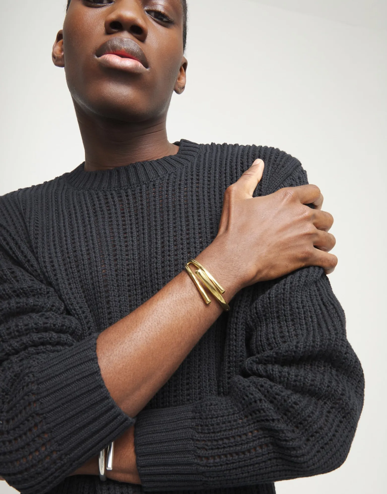 Bangle bracelet with three intertwined organic shapes