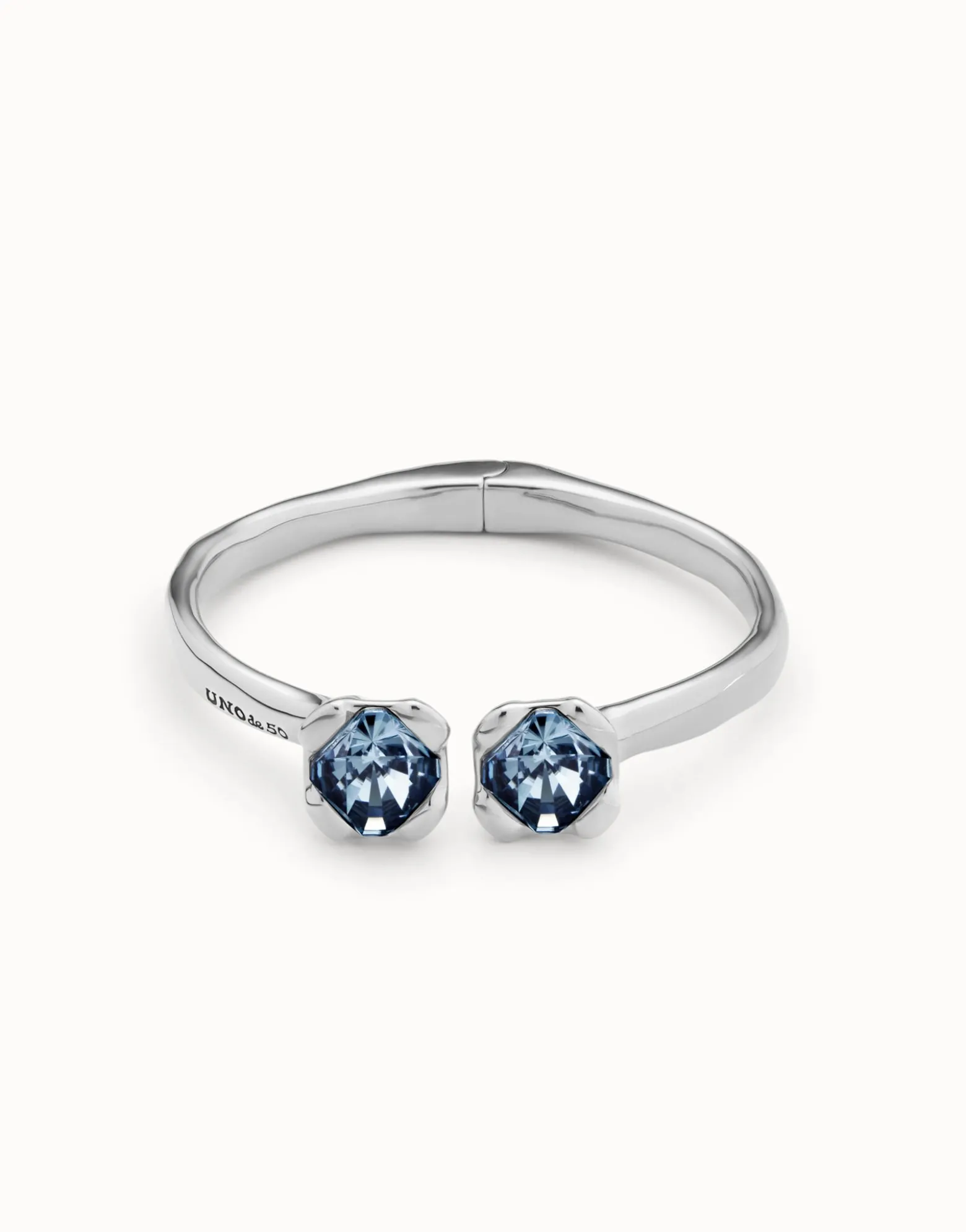 Bangle bracelet with two blue crystals