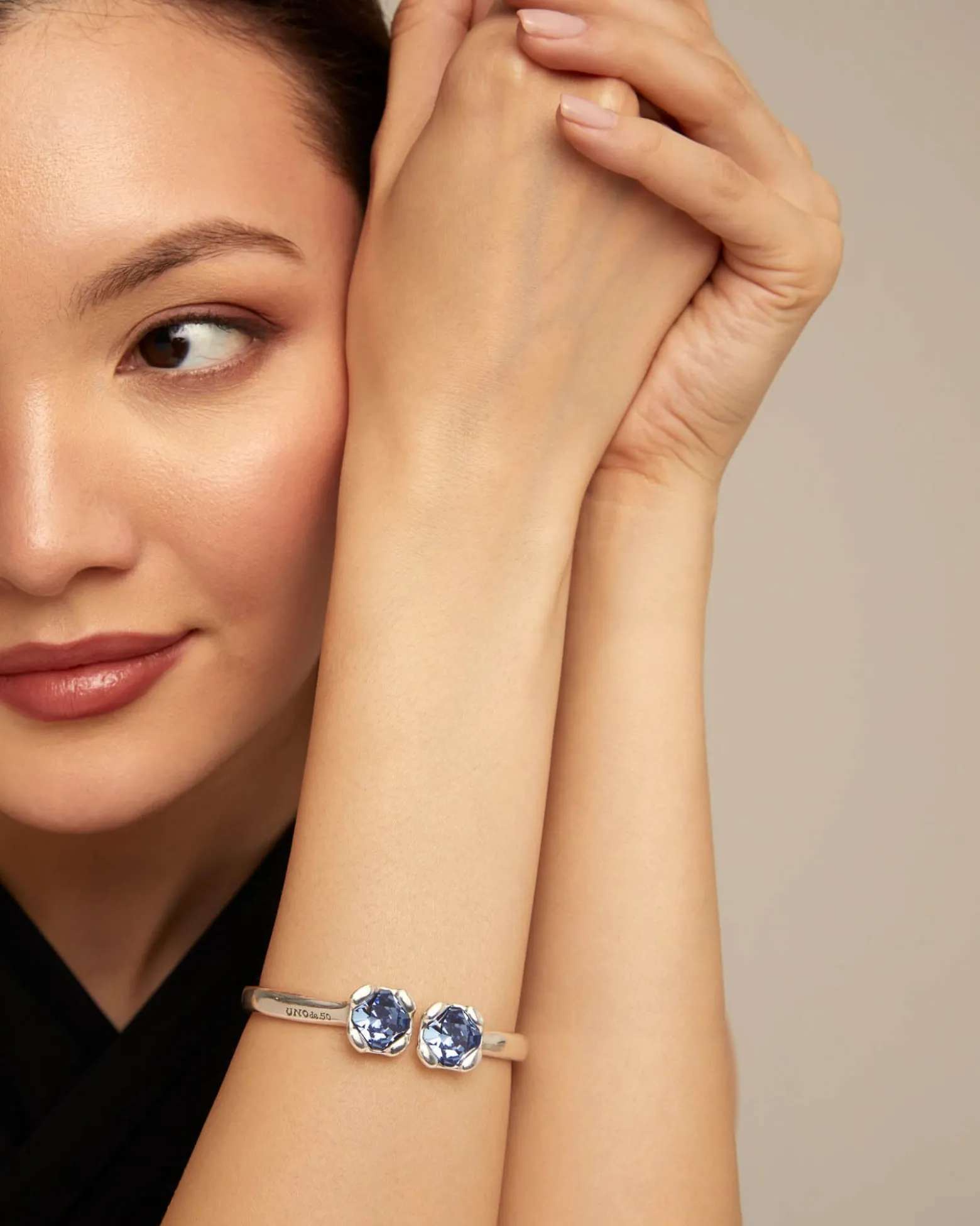 Bangle bracelet with two blue crystals