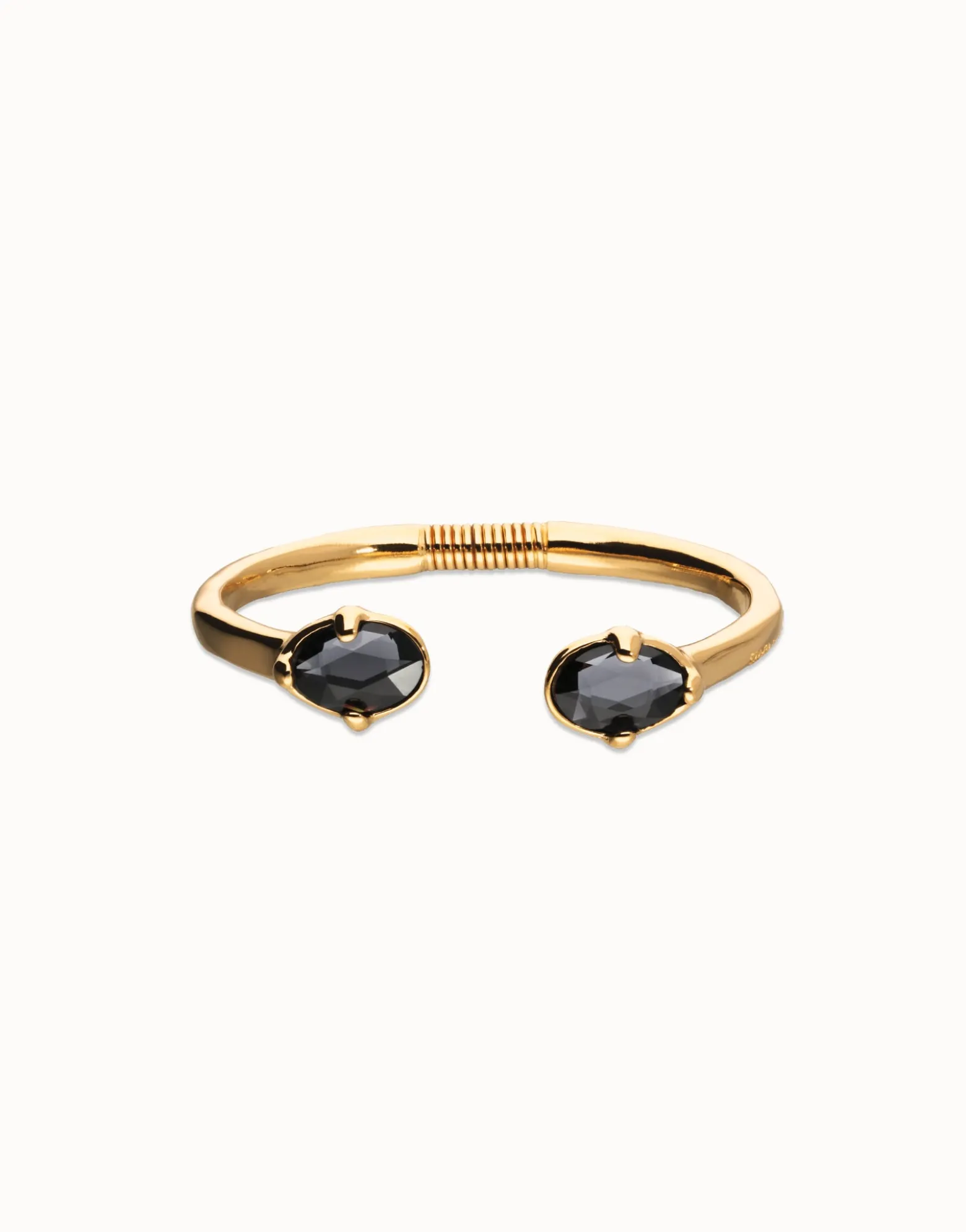 Bangle bracelet with two faceted black oval crystals