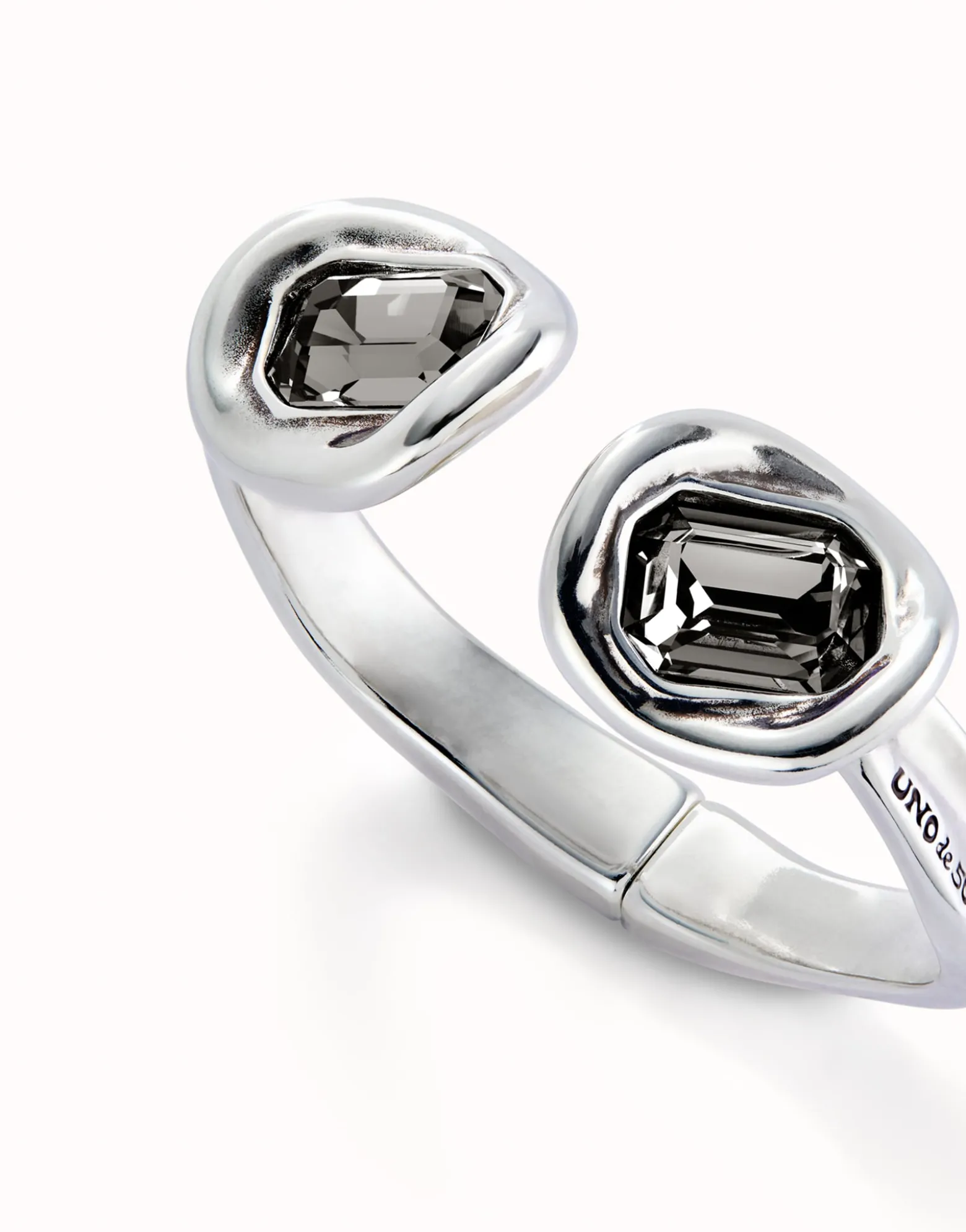 Bangle bracelet with two grey crystals