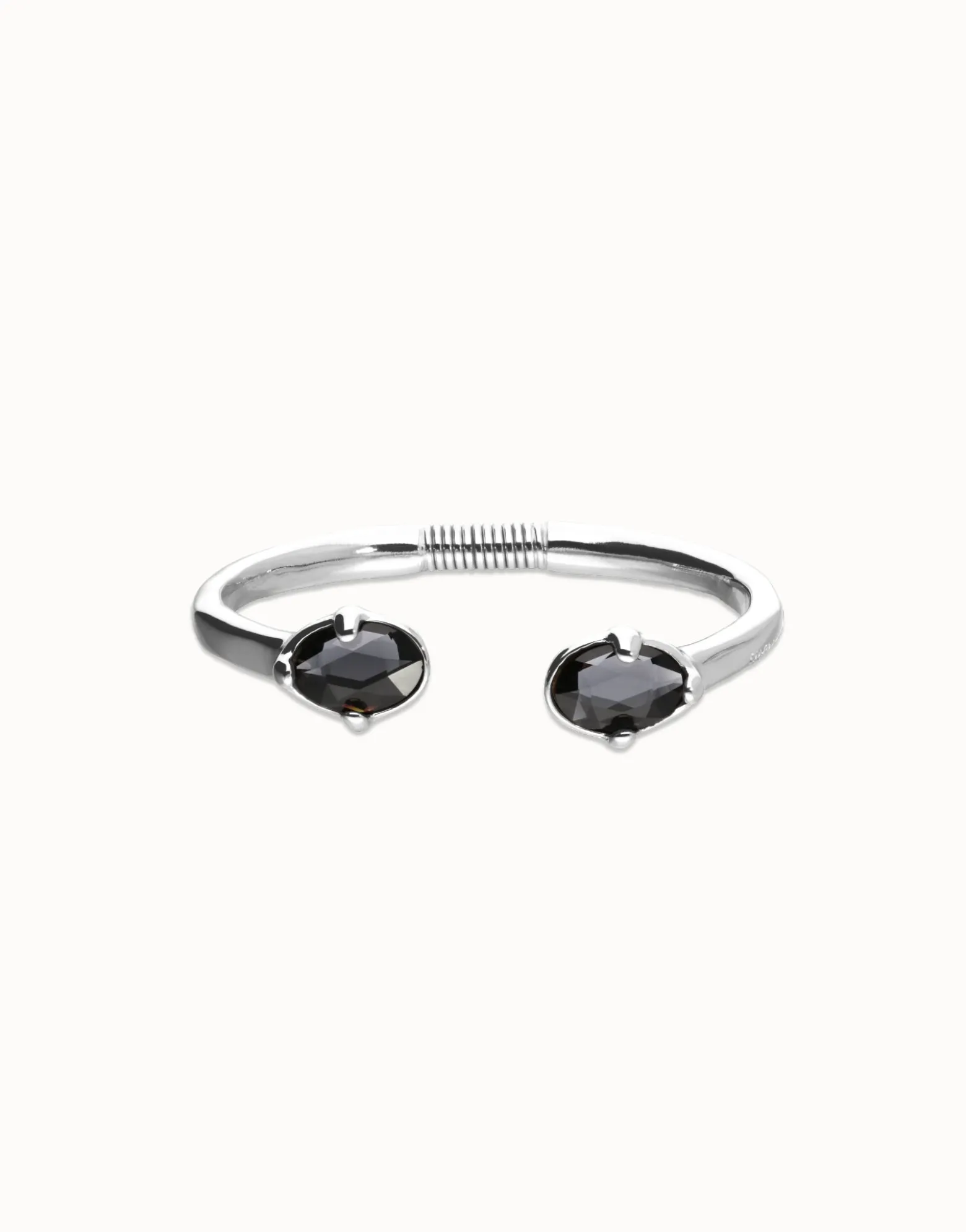 Bangle bracelet with two oval faceted black crystals