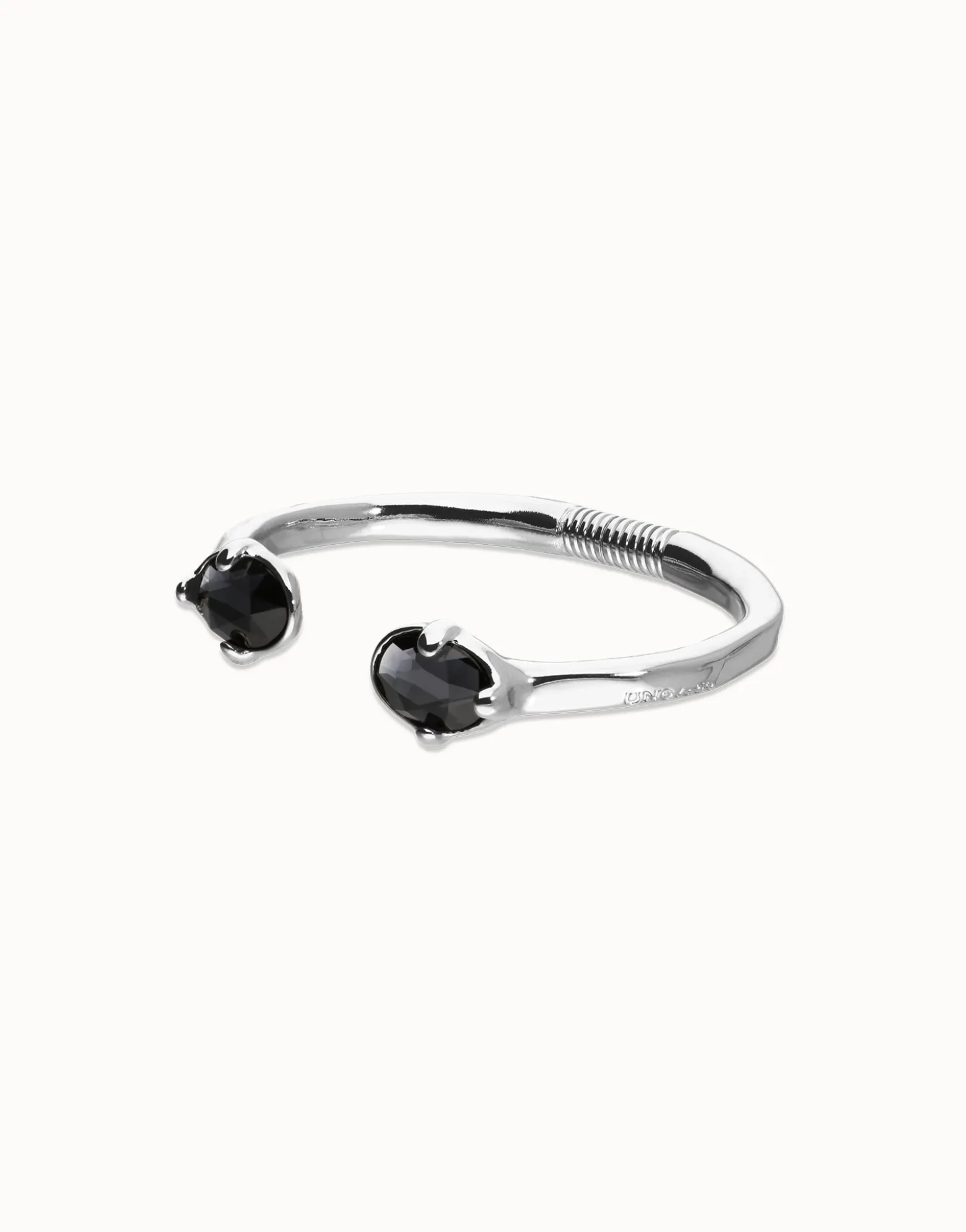 Bangle bracelet with two oval faceted black crystals