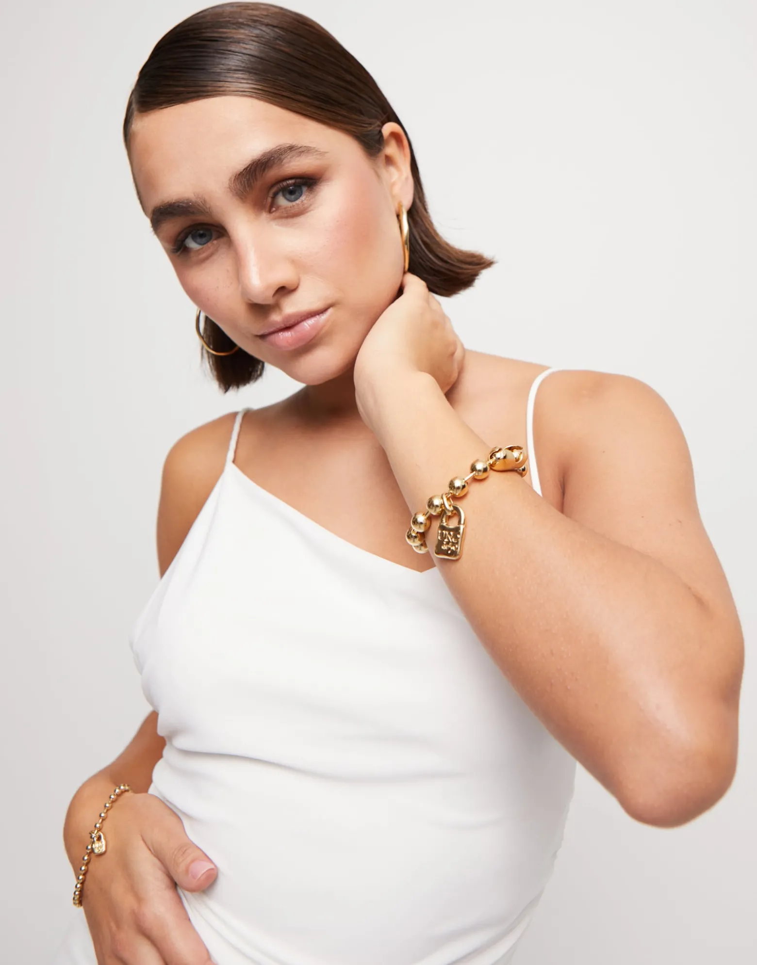 Beaded bracelet with a padlock charm