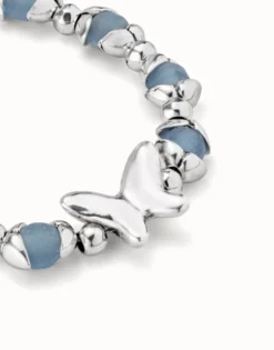 Beaded bracelet with blue crystals and a central butterfly