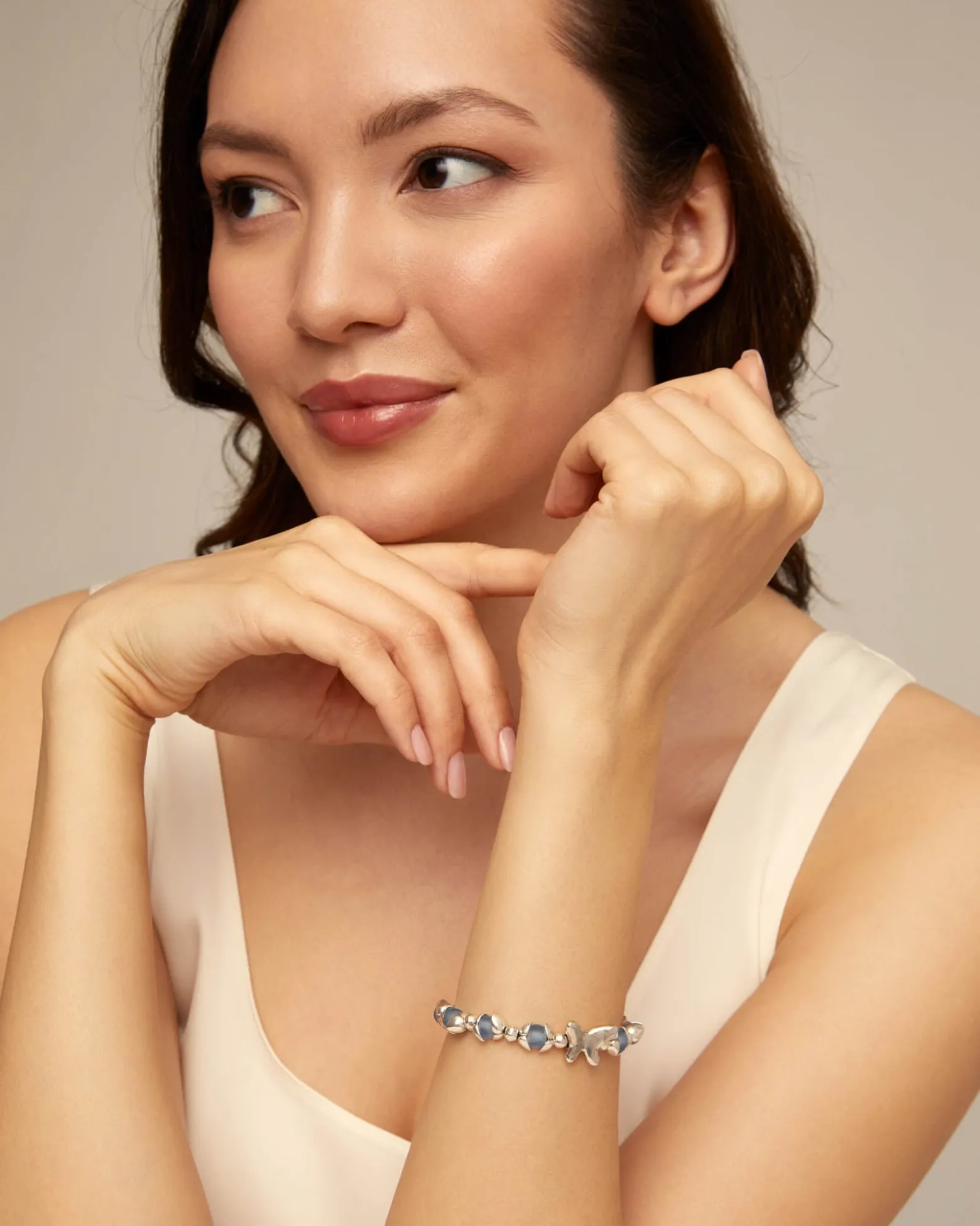 Beaded bracelet with blue crystals and a central butterfly