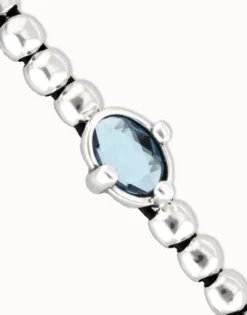 Beaded bracelet with blue oval faceted crystal