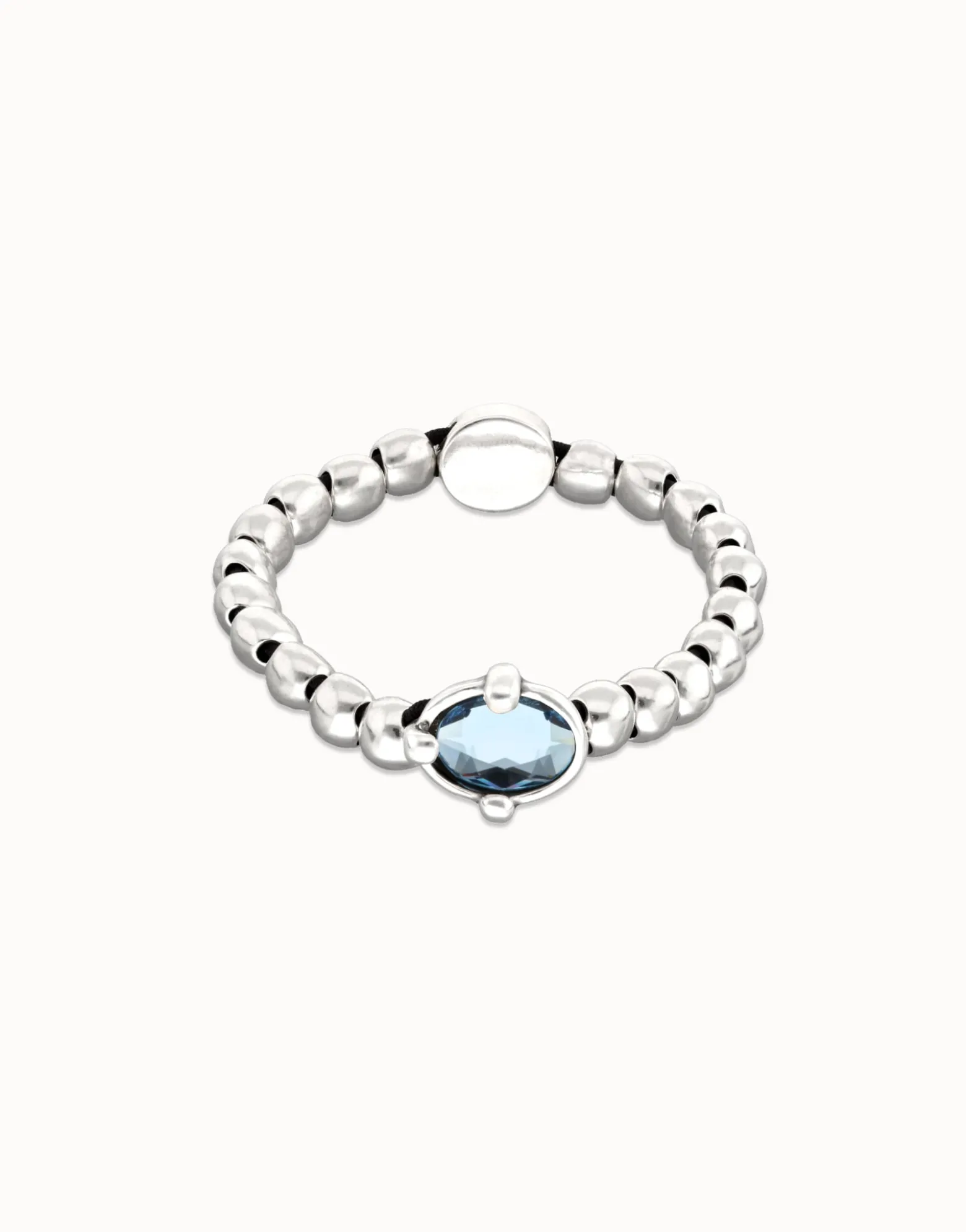 Beaded bracelet with blue oval faceted crystal