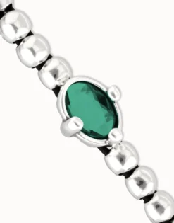 Beaded bracelet with oval faceted green crystal
