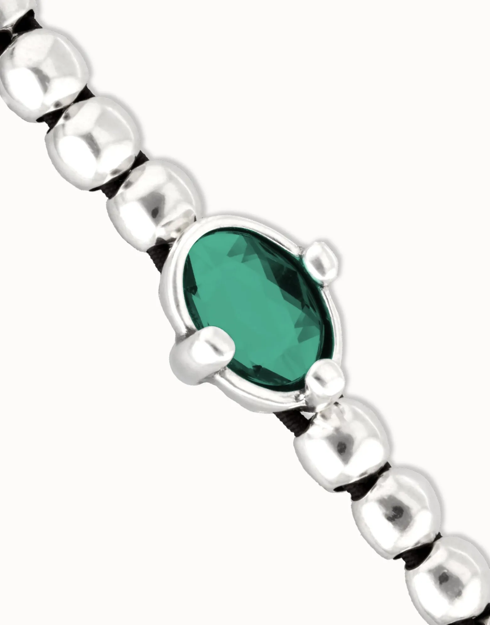 Beaded bracelet with oval faceted green crystal