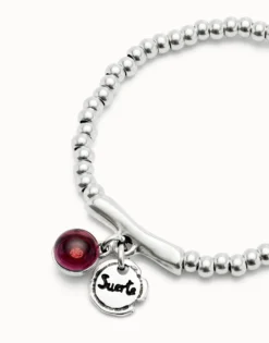 Beaded stretch bracelet with a murano glass and the word lucky