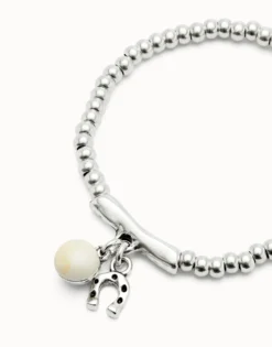 Beaded stretch bracelet with a murano glass and a horseshoe charm