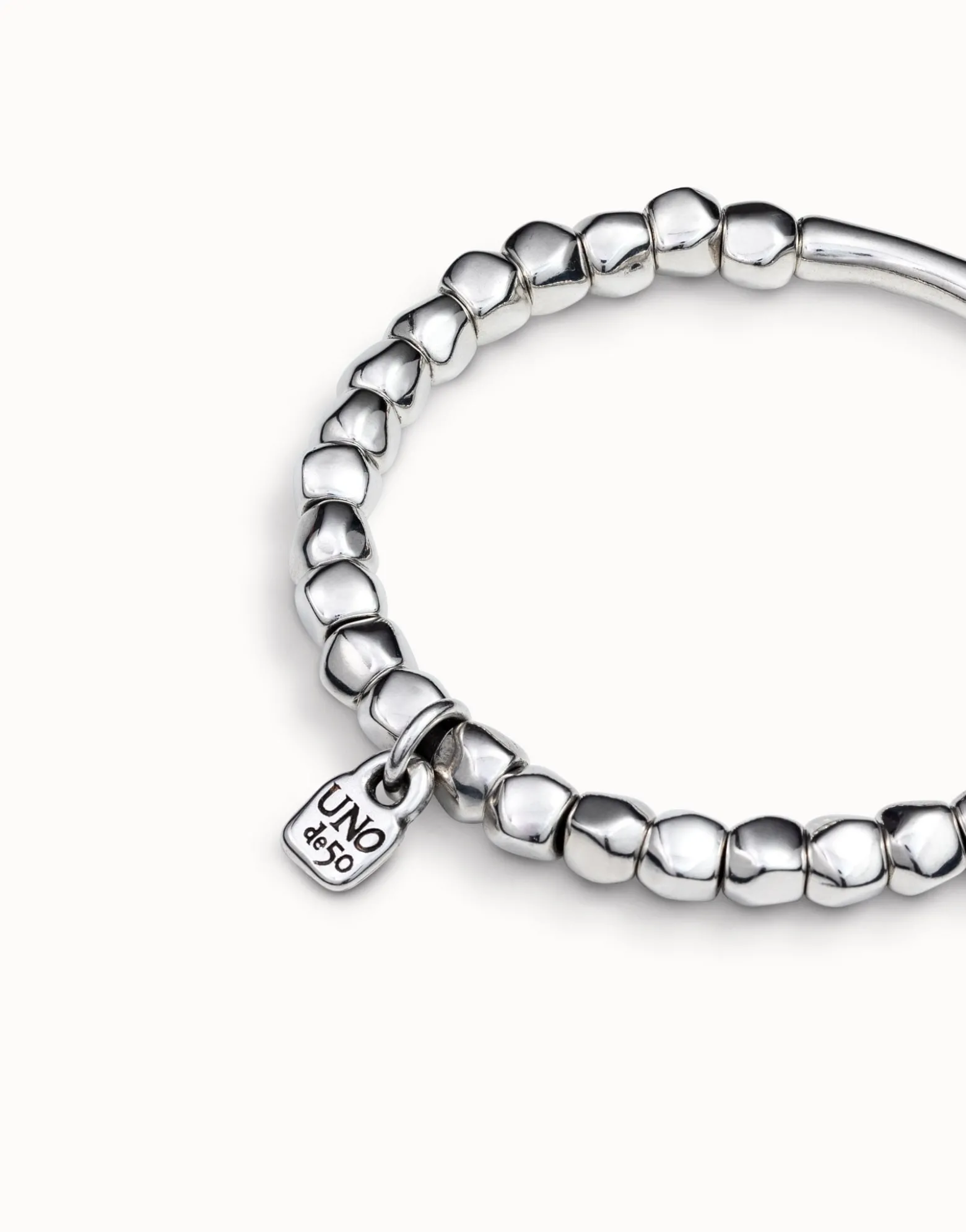 Beaded stretch bracelet with tubular piece