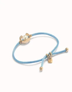 Blue cord bracelet with a pearl