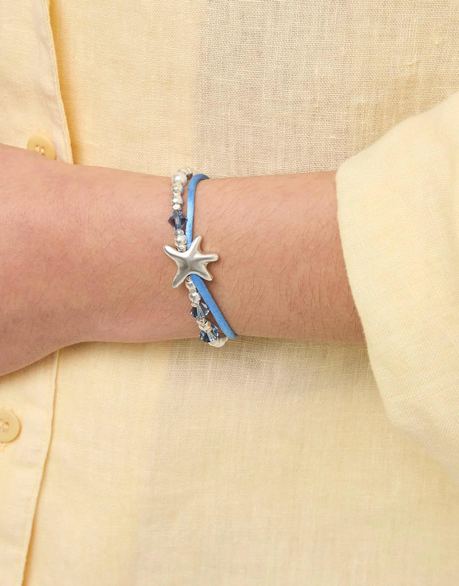 Blue silk thread and metal bracelet with starfish