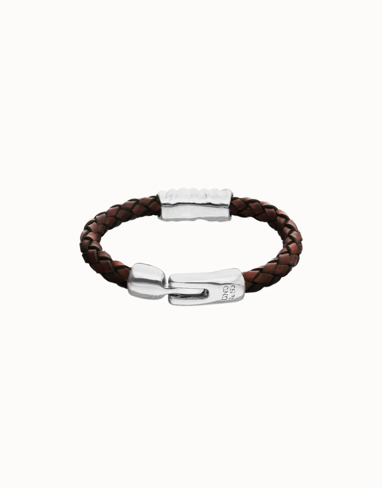 Brown braided leather bracelet with a metal detail