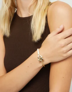 Cream leather bracelet with butterfly ornament