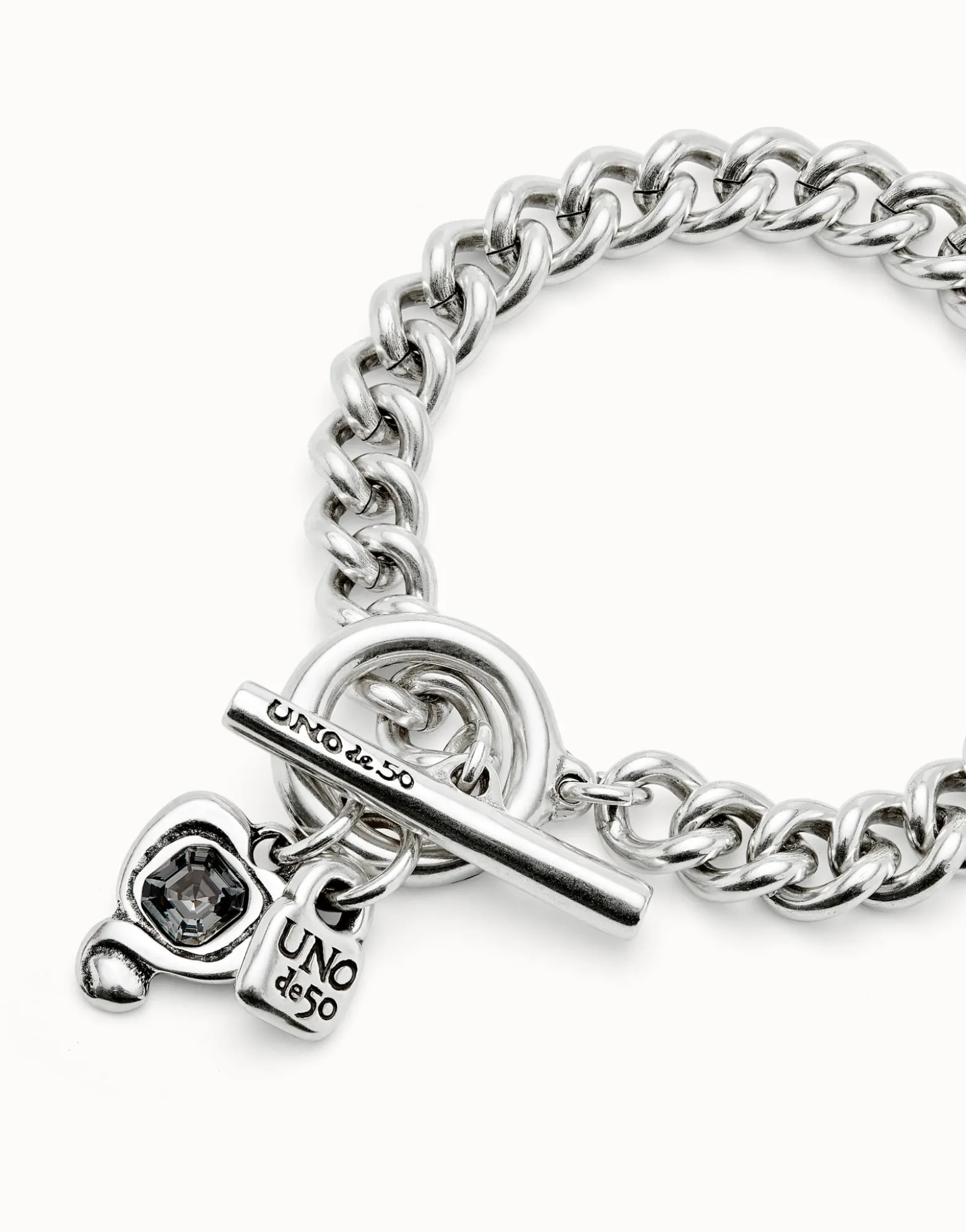 Curb link chain bracelet with charms