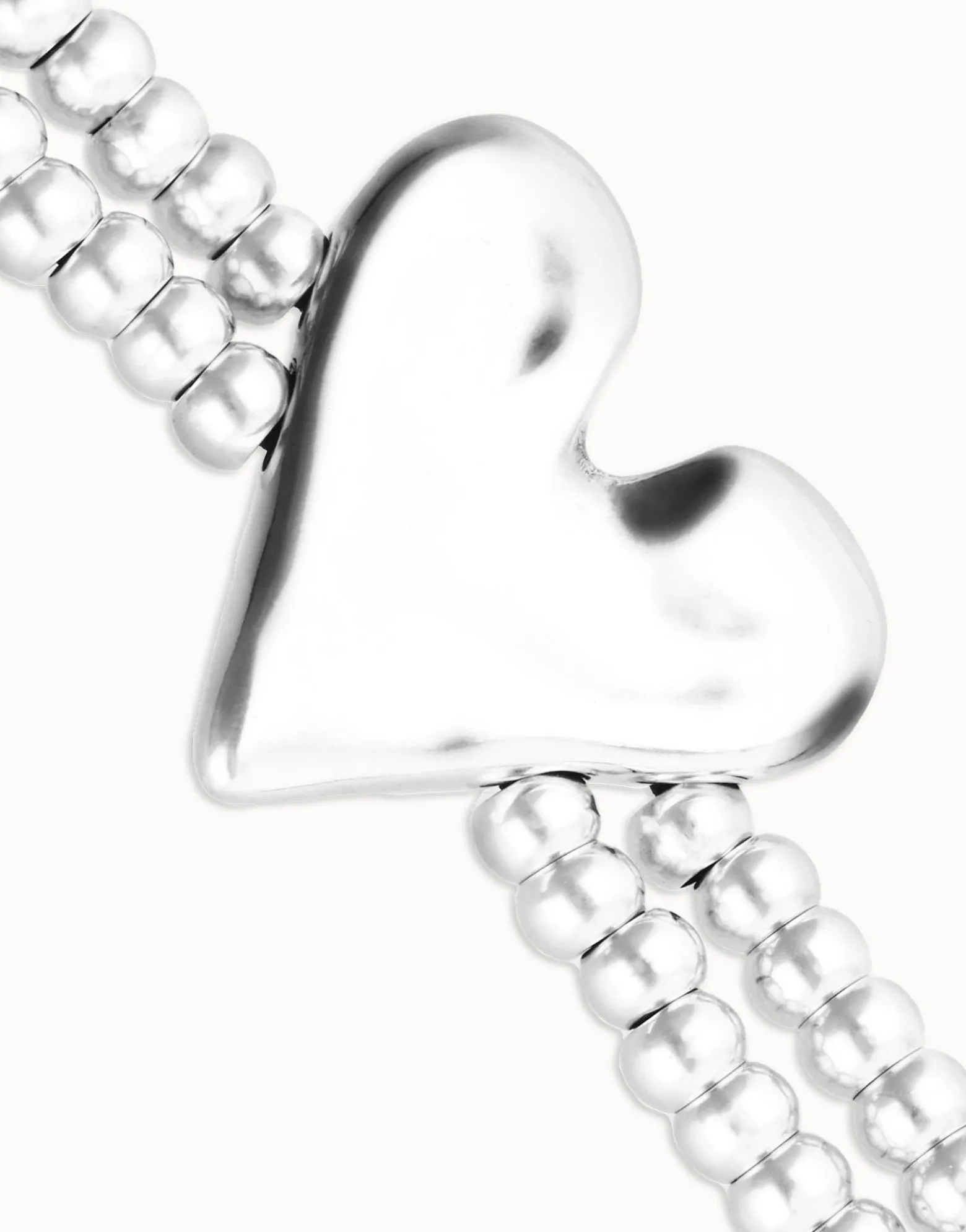 Double elastic bracelet with heart detail