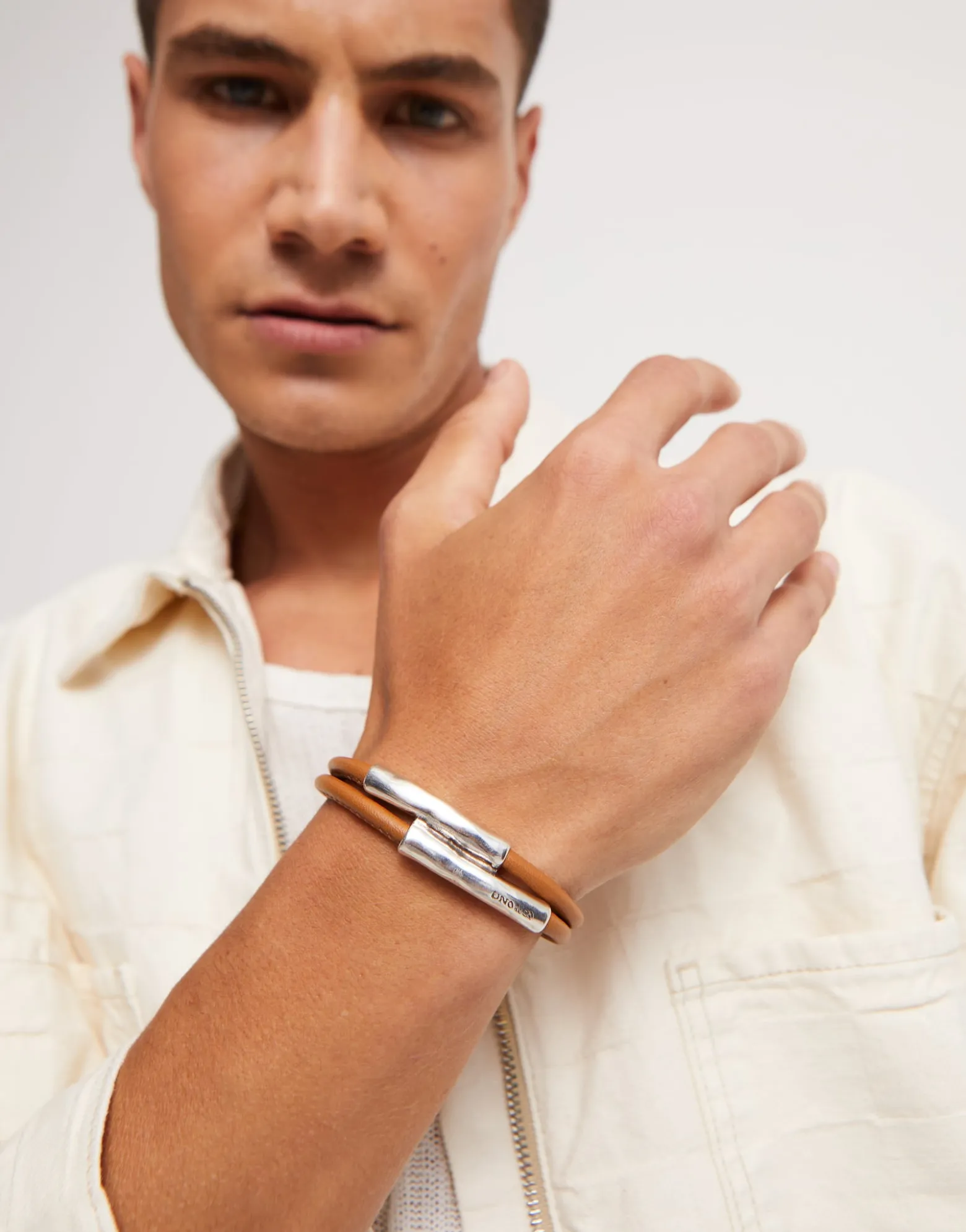 Double strand lether bracelet with two tubes