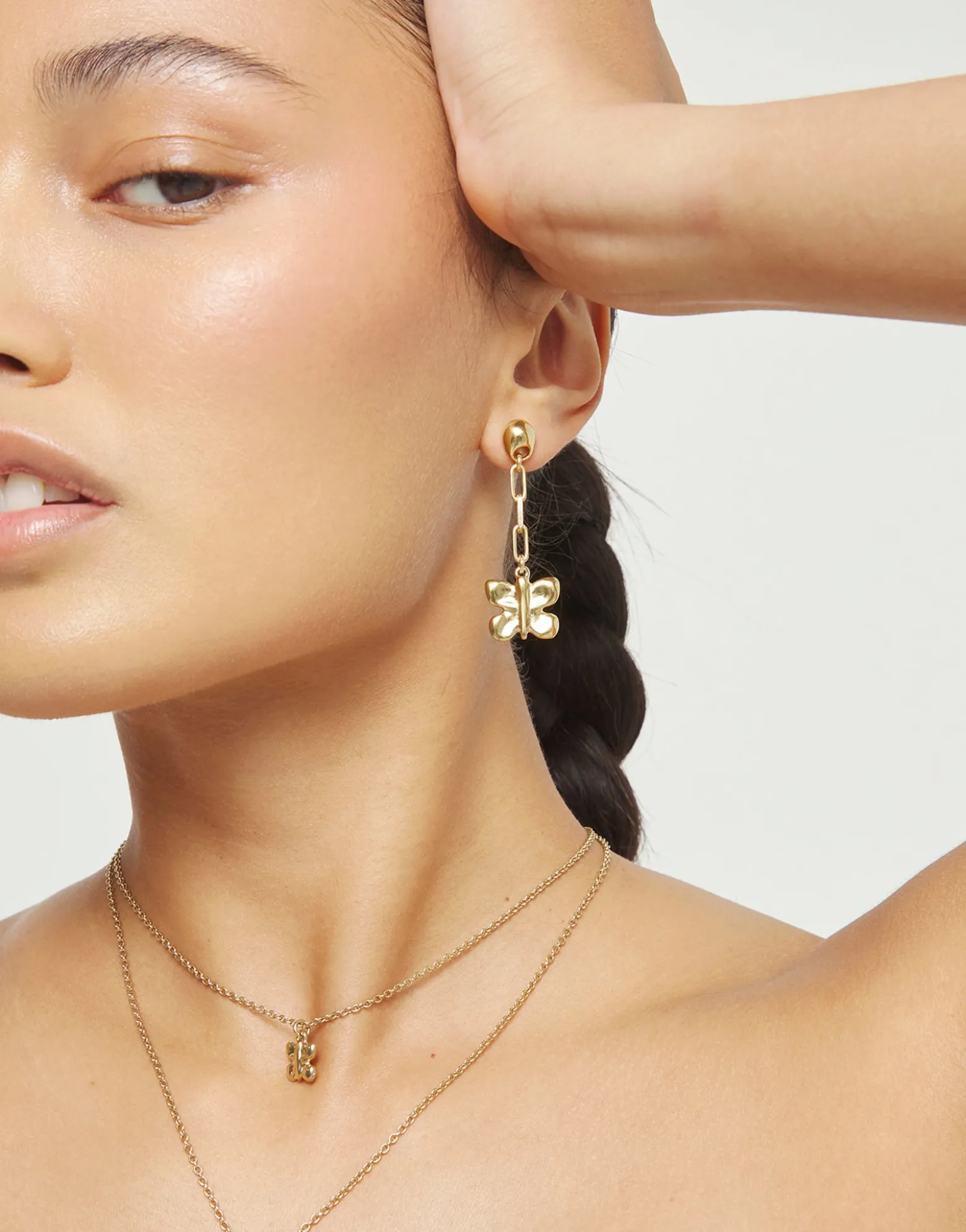 Drop earrings with a butterfly-shaped ornament