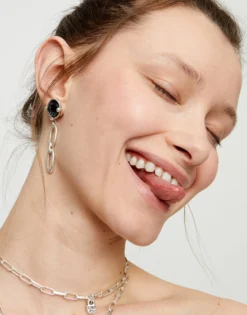 Drop earrings with faceted black crystal and links