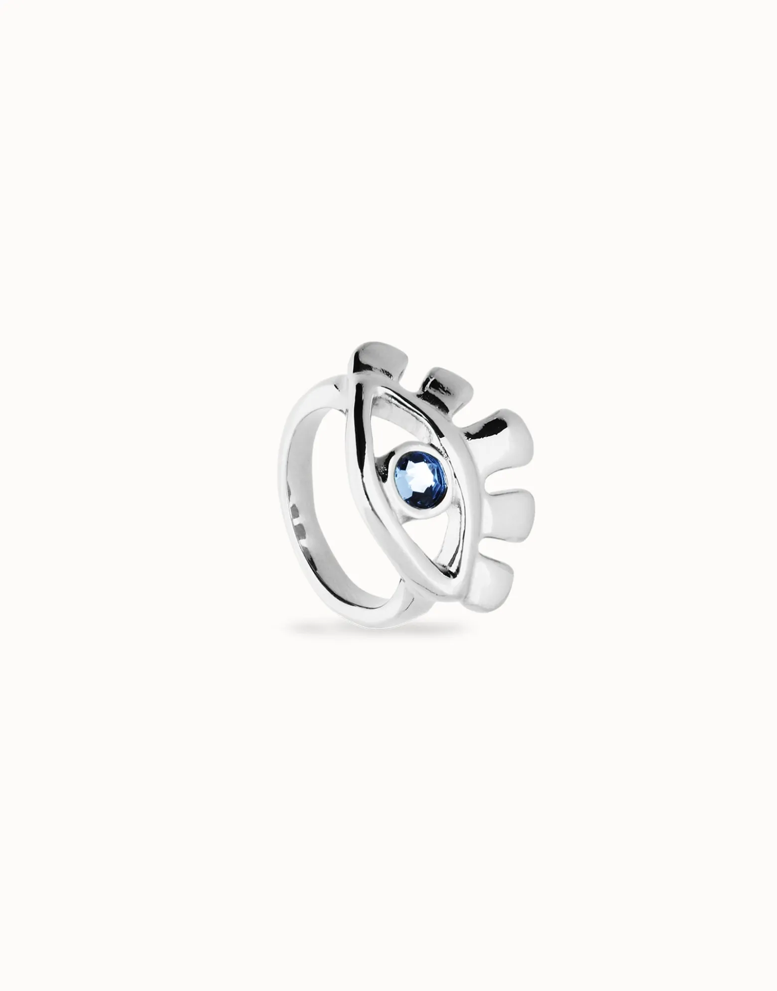 Eye-shaped ring with faceted blue crystal