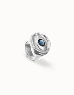 Eye-shaped ring with faceted blue crystal