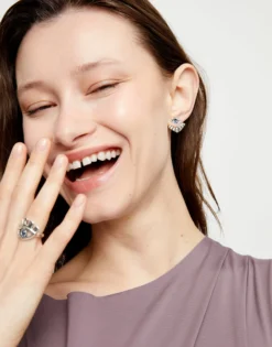 Eye-shaped stud earrings with blue crystal