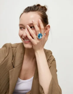 Large ring with blue oval faceted crystal
