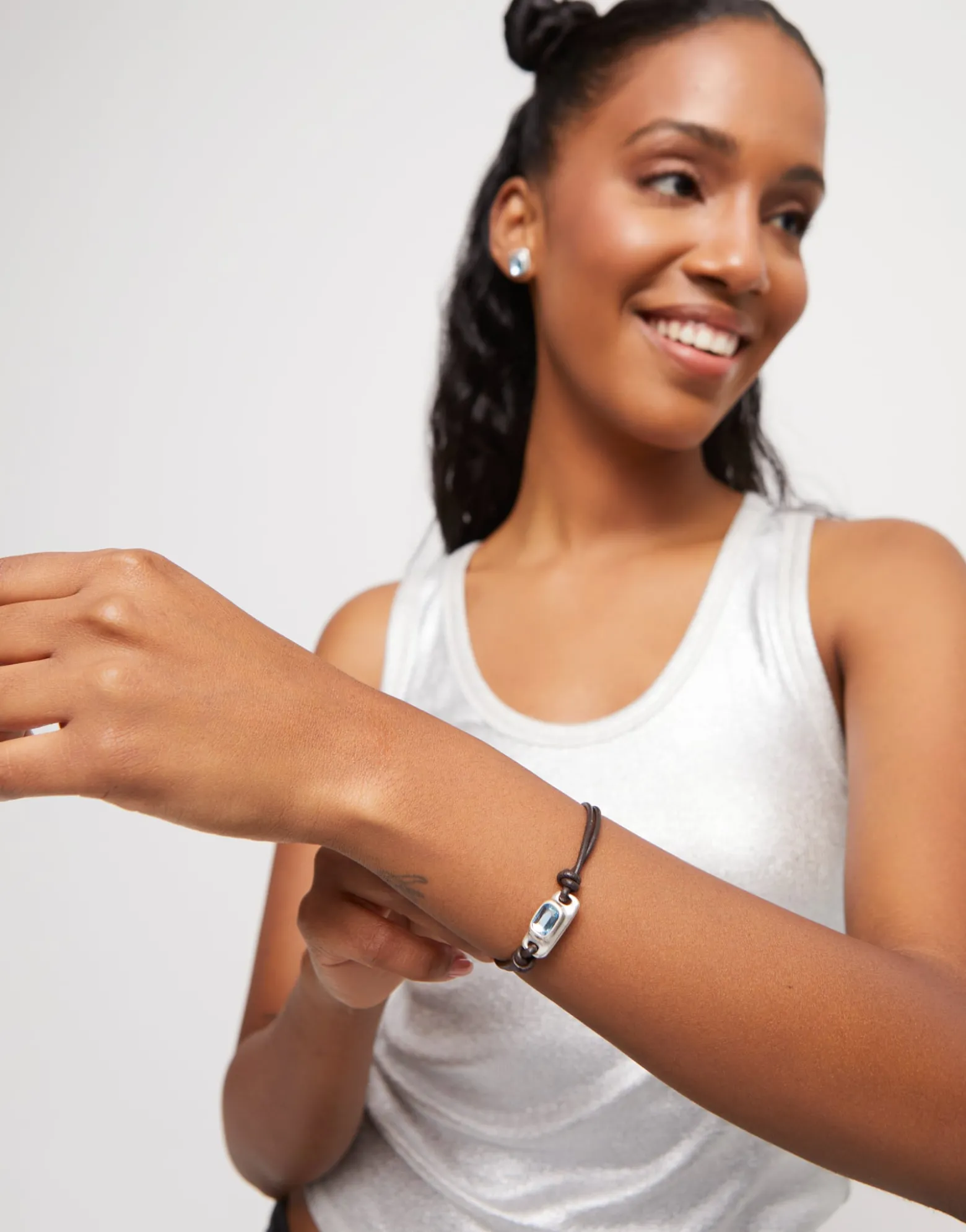Leather bracelet with a blue crystal