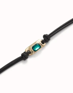 Leather bracelet with a green crystal