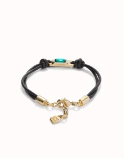 Leather bracelet with a green crystal