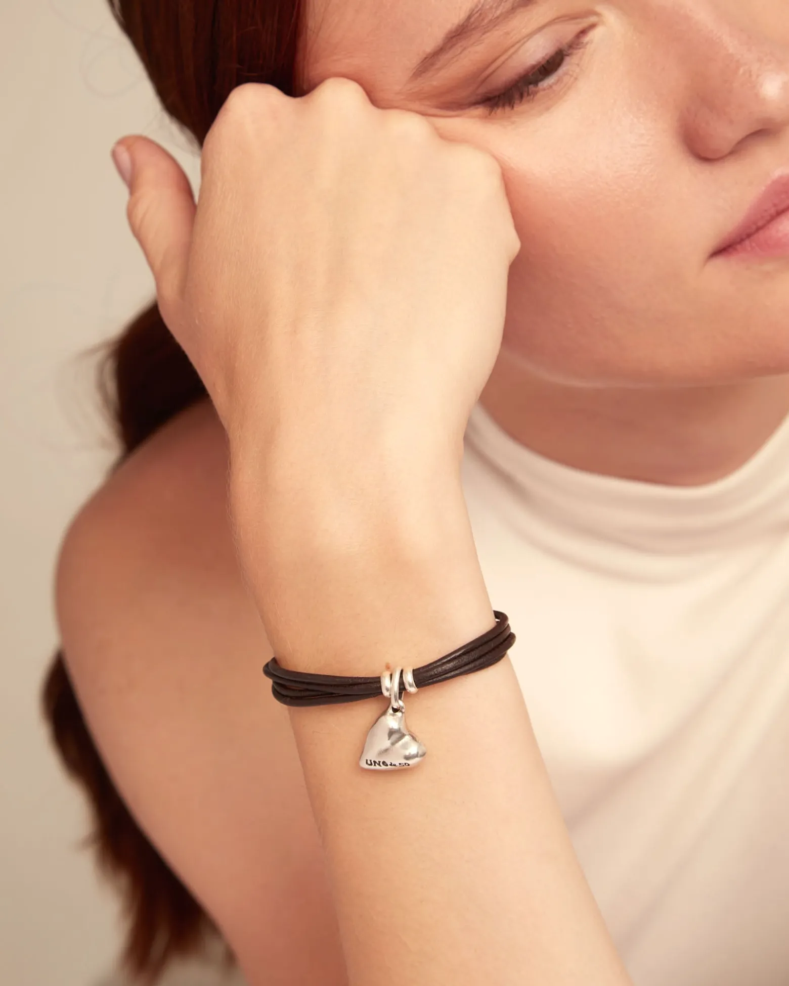 Leather bracelet with a heart charm