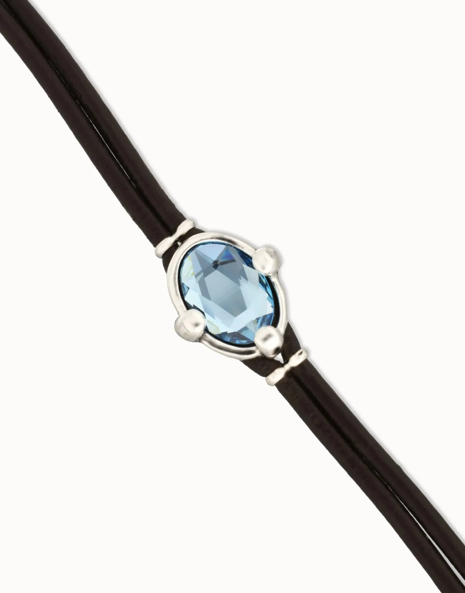 Leather bracelet with blue oval faceted crystal