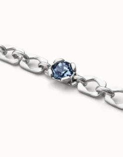 Link chain bracelet with a blue crystal
