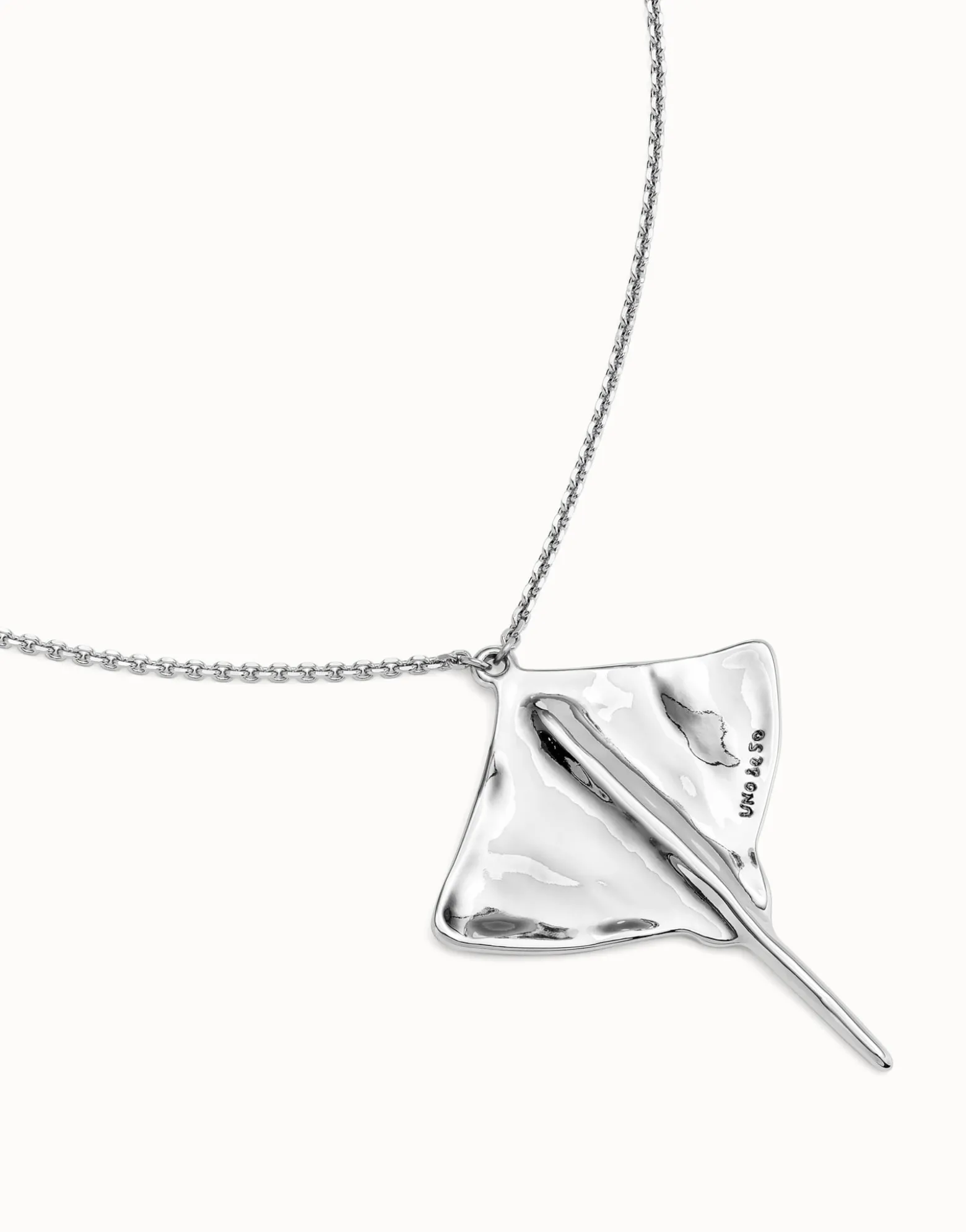 Long chain pendant necklace with manta ray