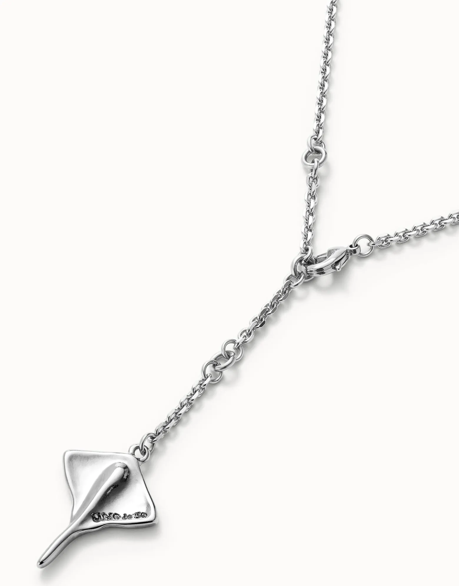 Long chain pendant necklace with manta ray