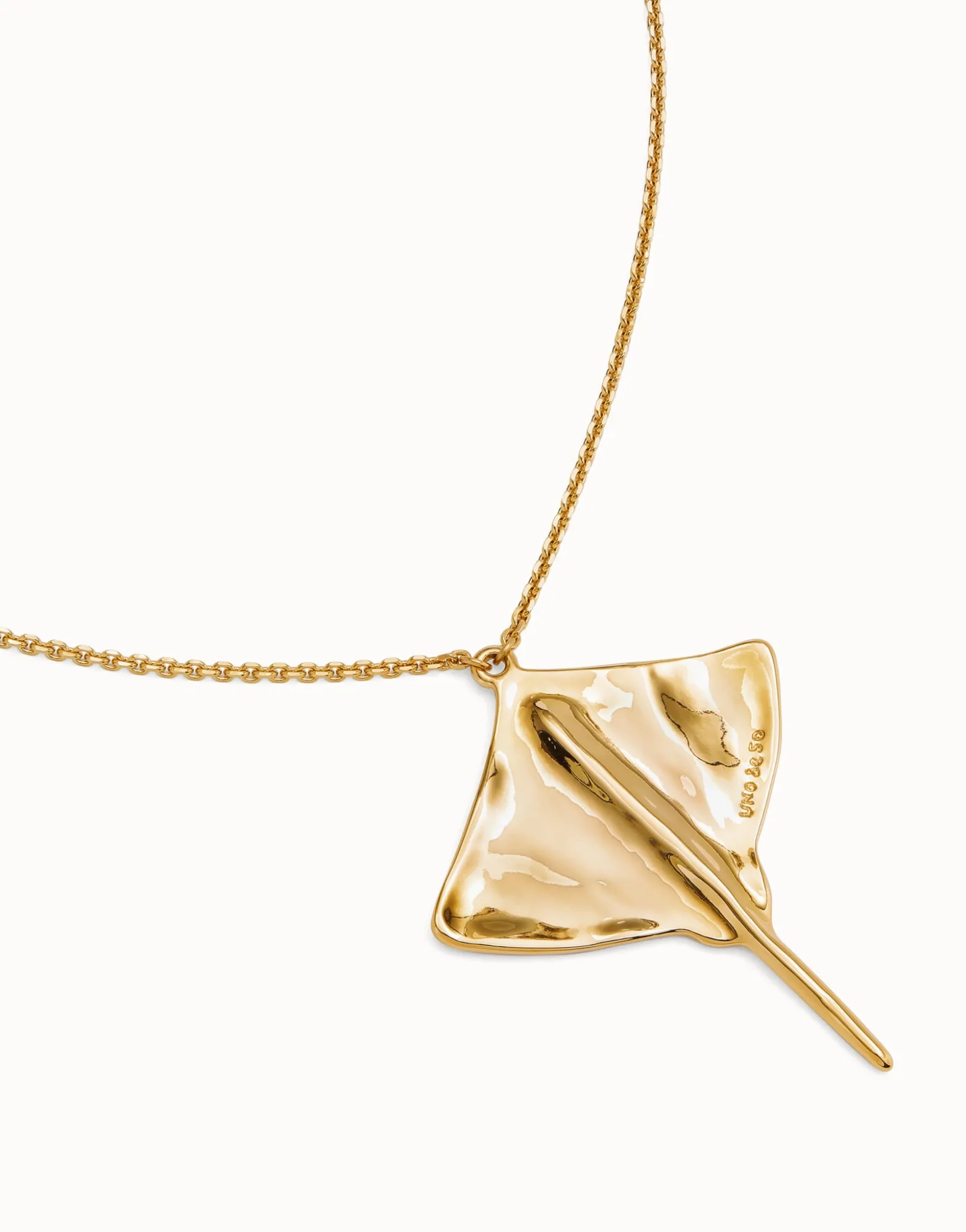 Long chain pendant necklace with manta ray