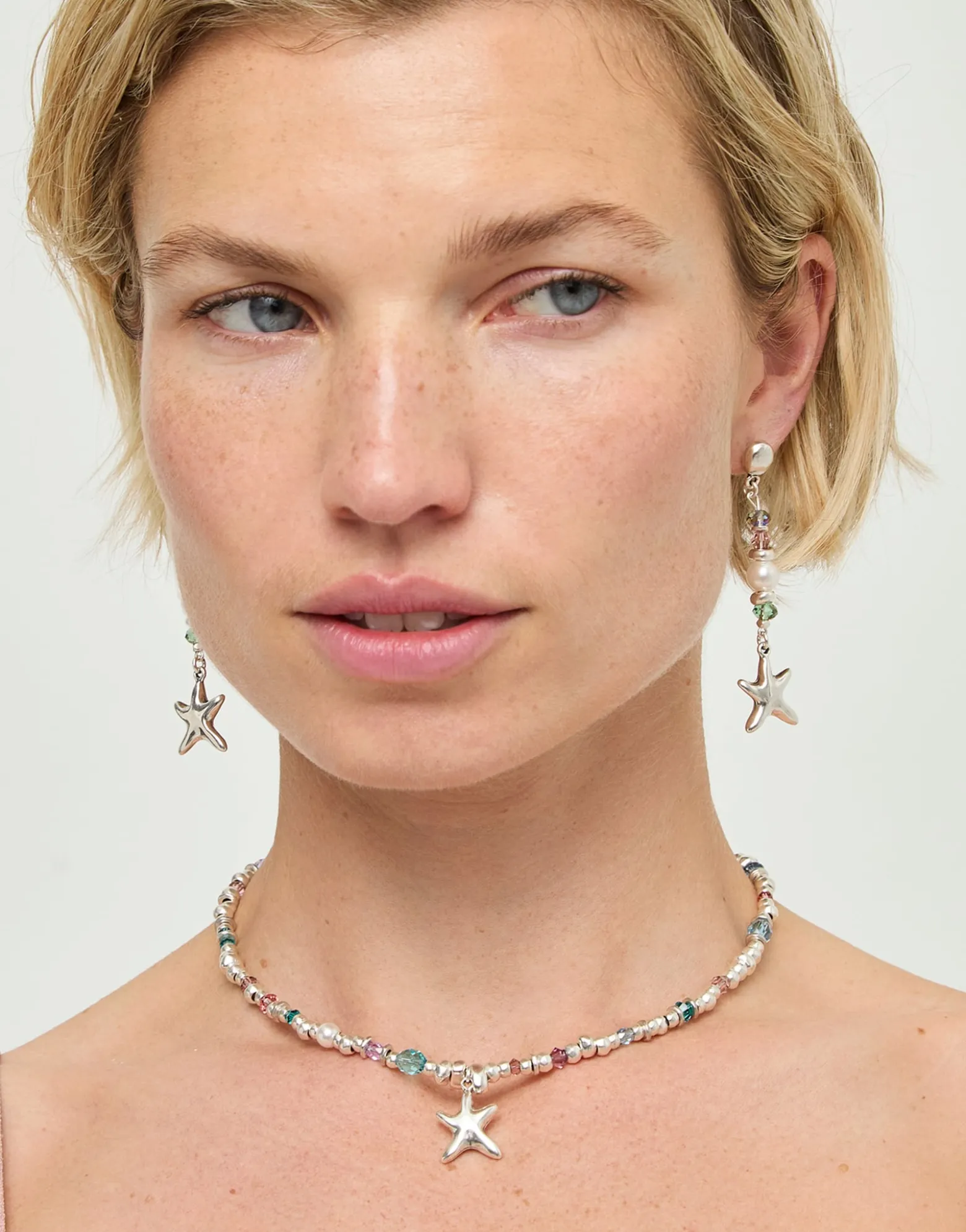 Long earrings with starfish and pearl