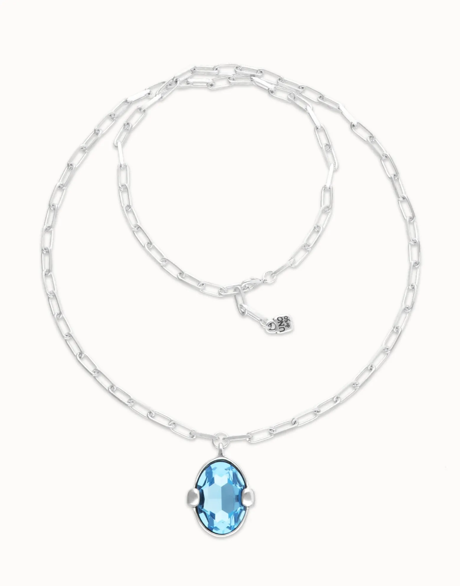 Long necklace with large blue oval faceted crystal